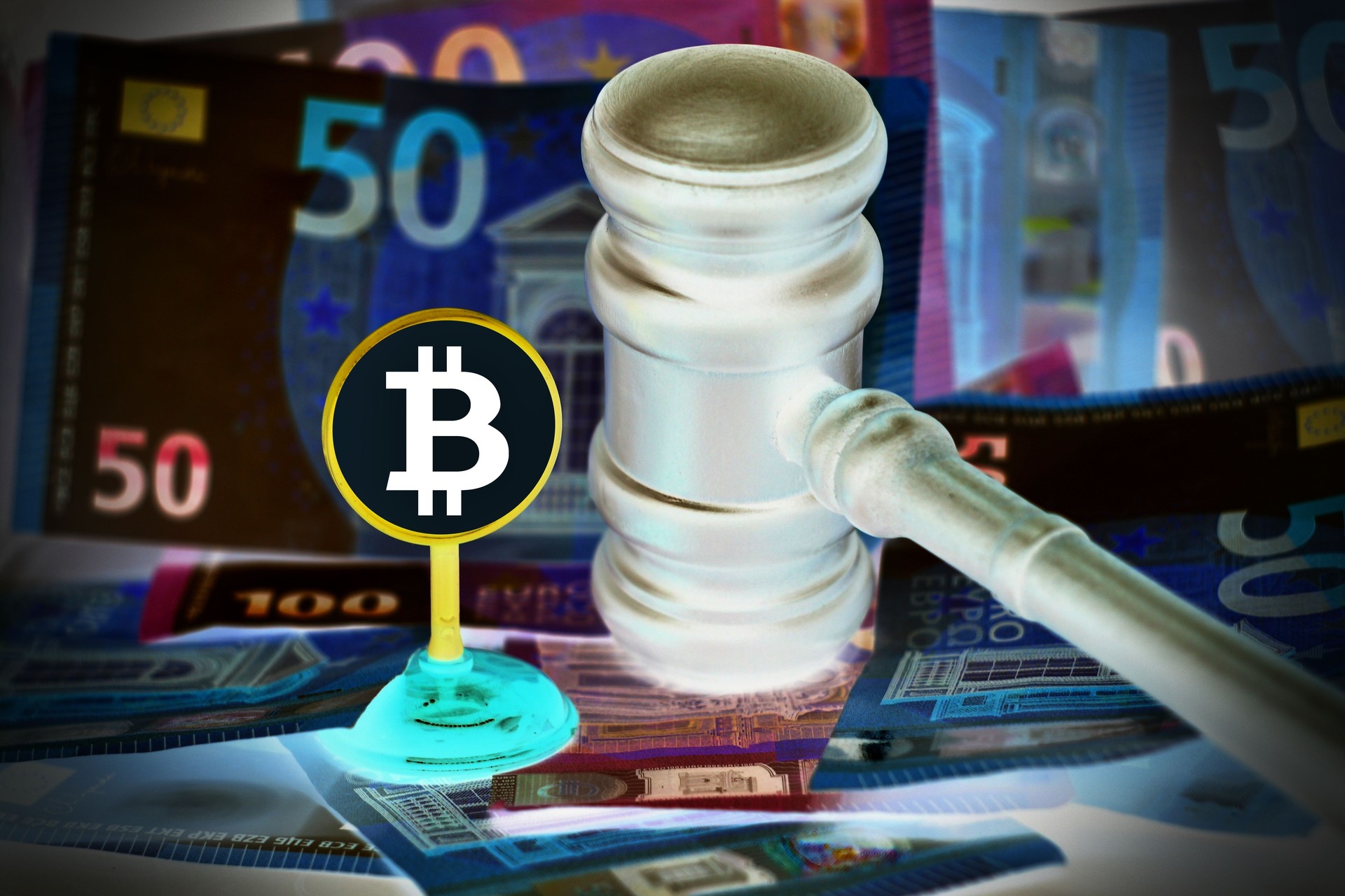 Auction gavel and bitcoin cryptocurrency money on a wooden desk, close-up. Law Gavel and golden bitcoin symbol on white background with copyspace Auction gavel and bitcoin cryptocurrency money on a wooden desk, close-up. Law Gavel and golden bitcoin symbol on white background with copyspace